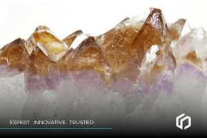 computer forensics - Close-up of amethyst crystals with text "Expert. Innovative. Trusted." for eDiscovery solutions.